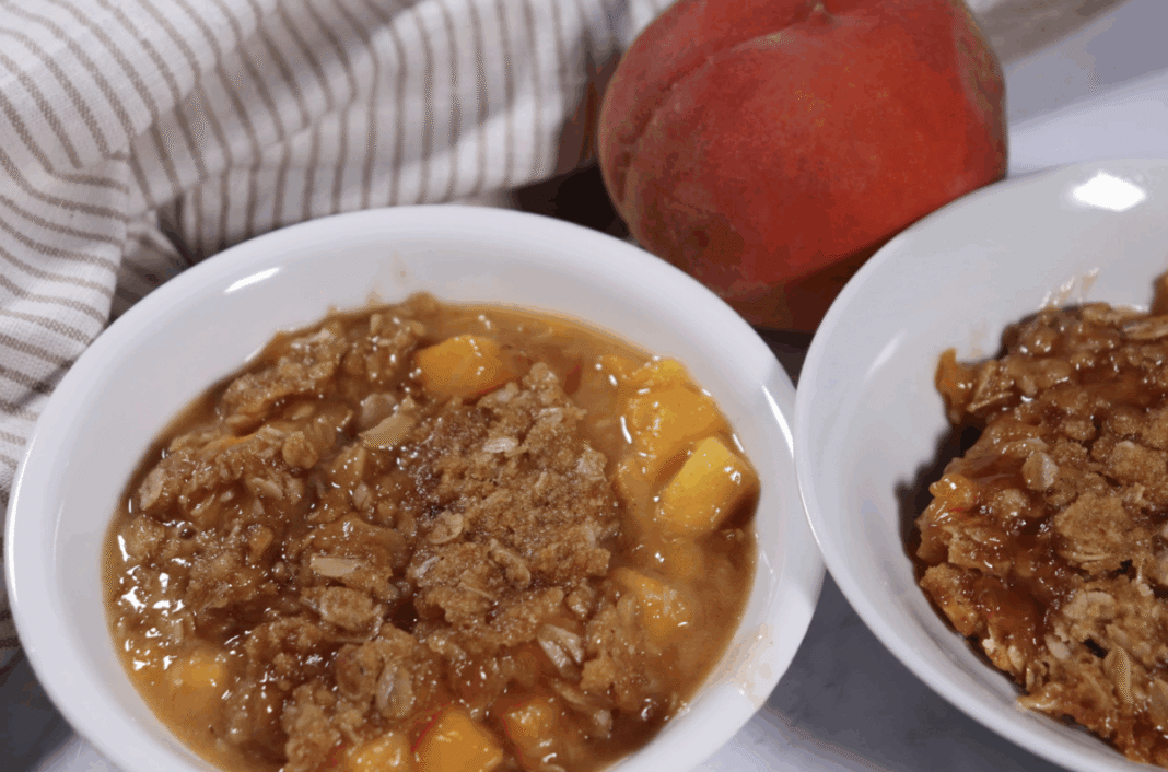 peach crisp with an oat topping in individual serving dishes